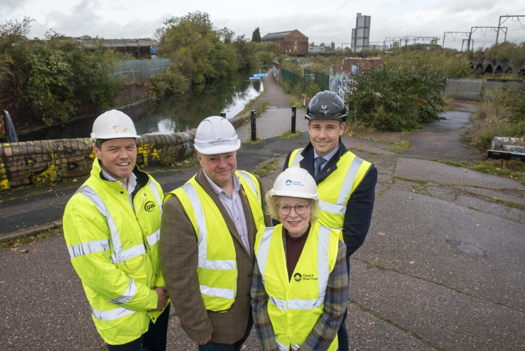 Mark Birks, Principal and Head of Residential Birmingham at Avison Young, Cllr Stephen Simkins, City of Wolverhampton Council Leader, Cheryl Blount-Powell, National Property Development Manager at the Canal & River Trust, and James Dickens, Managing Director of Wavensmere Homes, with the Canalside South site to the right. 