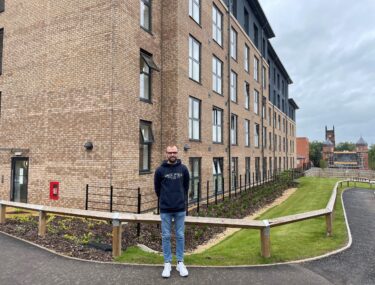 Oliver Bickle outside the Strutt House apartment building at Nightingale Quarter